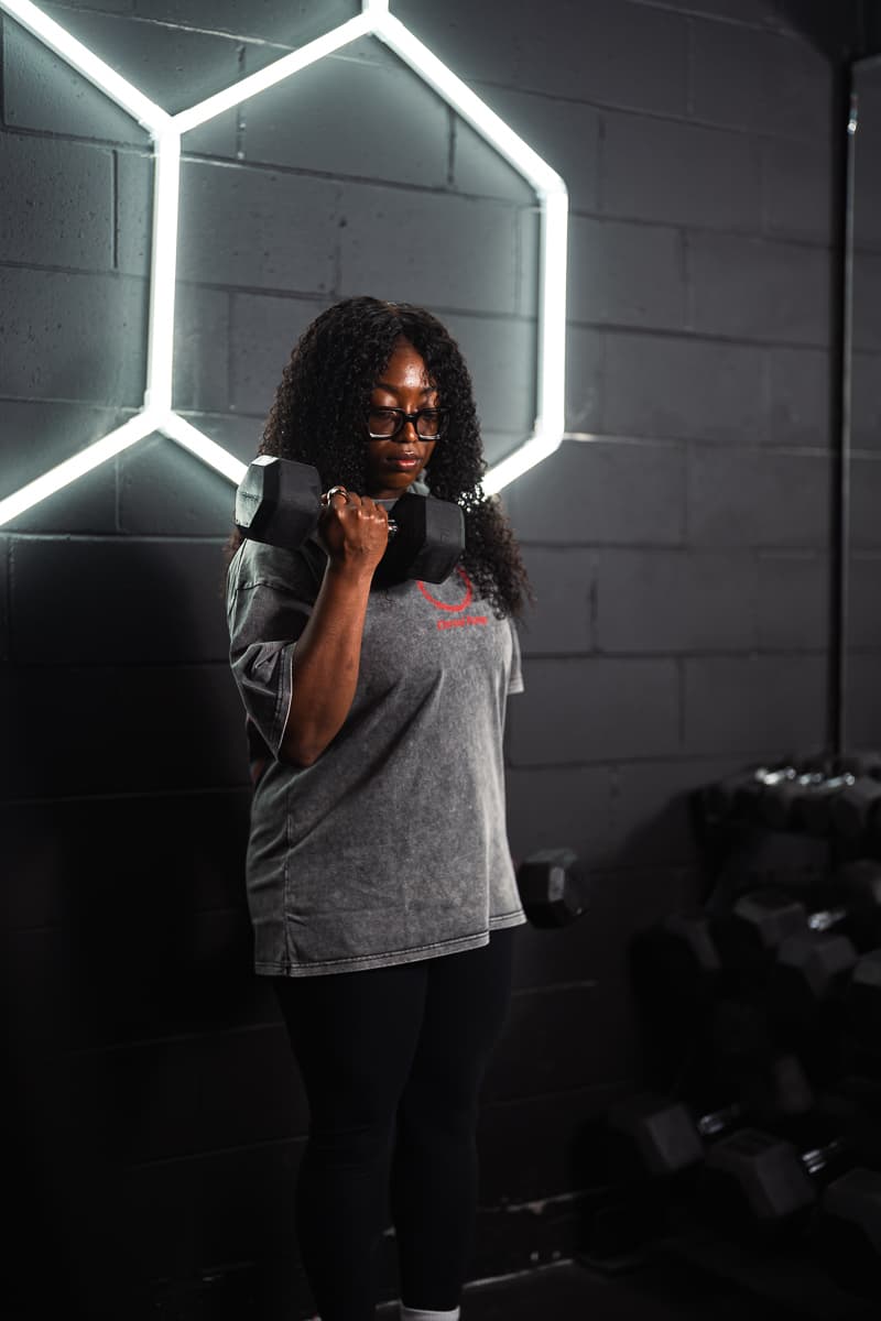 Athlete curling a dumbbell in Eternal Pump apparel